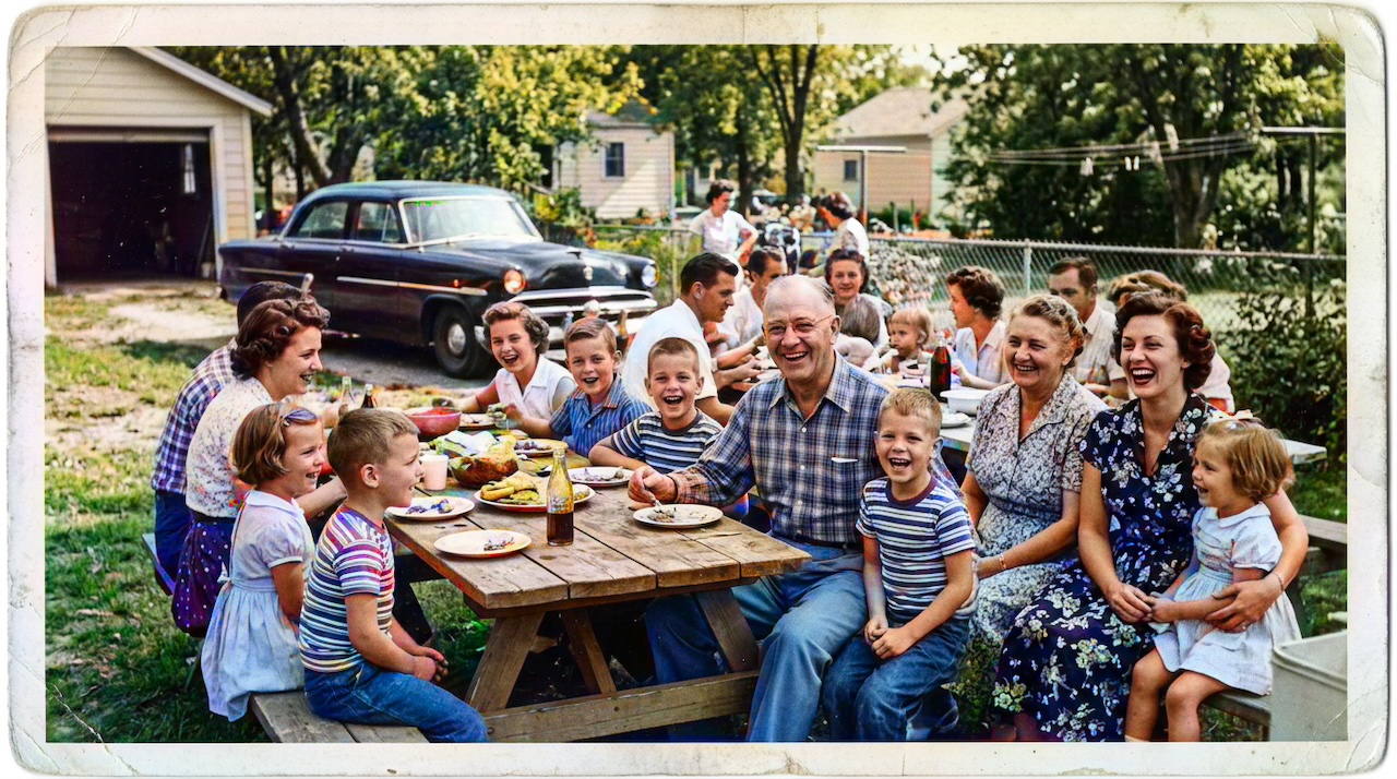 AI colorized ai colorization — AI colorized 1950s family picnic with natural skin tones, green lawn, and period clothing colors